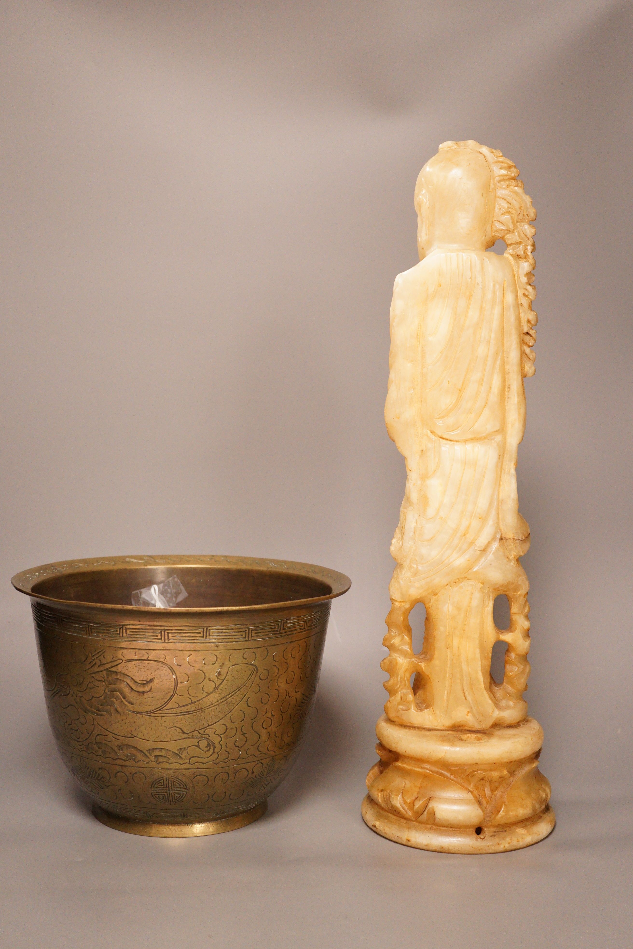 A Chinese bronze 'dragon' bowl, early 20th century and a large Chinese soapstone figure of Shou Lao, 28cm tall